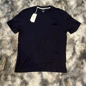 Lacoste Tshirt navy blue with the tag.